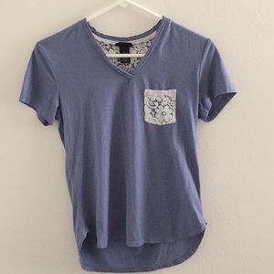 Blue tee shirt with white lace accents.